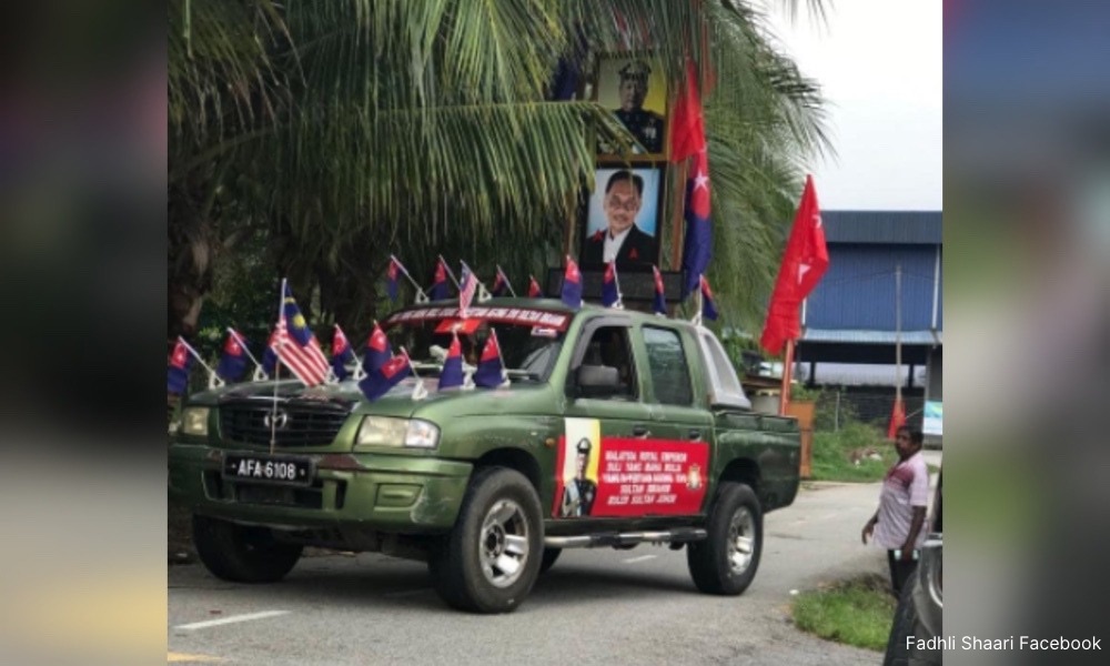 truck-with-agong’s-portrait,-harapan-flags-causes-stir-in-kkb