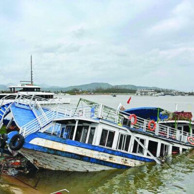 typhoon-weakens-after-leaving-dozens-dead-in-vietnam,-china-and-philippines